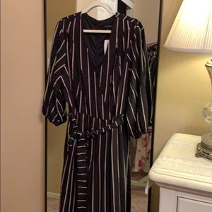 Black jumpsuit with a maroon and ivory stripe